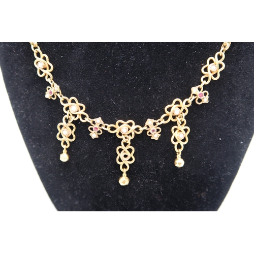  A 14ct yellow gold (tested) necklace with seed pearls and amethysts - approx weight 25.2 grams