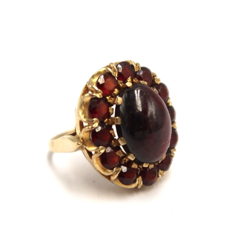  A 9ct yellow gold hallmarked garnet cluster ring size O/P - weight approx 8.6 grams