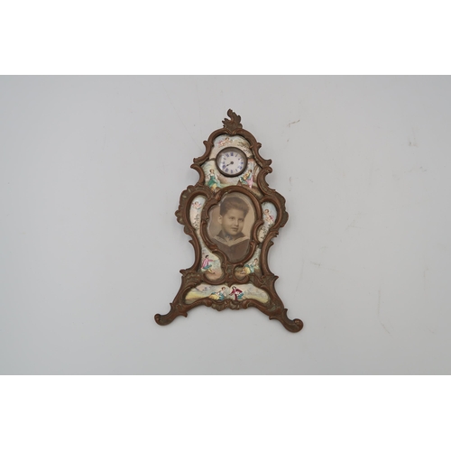 483 - A Continental gilt framed enamel watch and picture frame, approx 18cm high