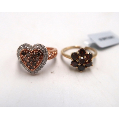 Two 9ct gold diamond rings. A cognac diamond circular cluster, diamond weight 1.01cts, Size K. A champagne and white diamond heart shape cluster, 0.75ct, size K. Total weight 5.08 grams