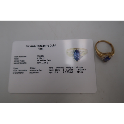 106 - A 9ct gold marquise tanzanite and diamond dress ring. Size K. Weight 2.40 grams