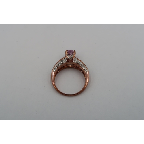 121 - A 9ct gold oval kunzite and white sapphire dress ring. Size N 1/2. Weight 4.50 grams.