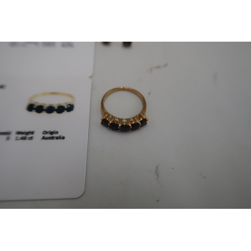 123 - A 9ct gold sapphire five stone ring, size O. Together with 9ct sapphire ear studs. Weight