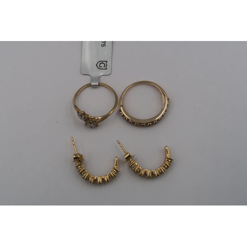 125 - Three pieces of 9ct gold Alexandrite jewellery. To include a pair of ear hoops, a 12 stone ring, siz... 