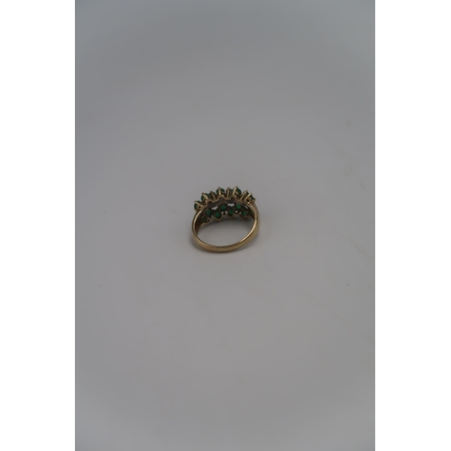 139 - A marked .375 Yellow gold dress ring with central line of small round cut diamonds, Size T. 3.8grams... 