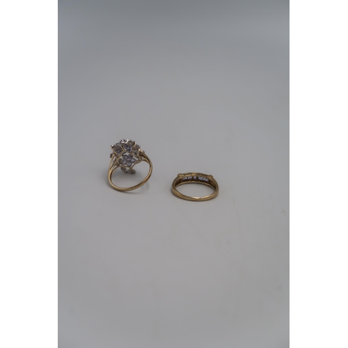 140 - Two marked .375 Yellow gold dress ring set with  Lilac coloured stones to shoulder Size T. and a mar... 