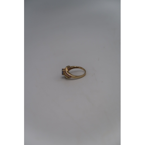 149 - A marked .375 Yellow gold dress rings with central Lilac coloured stone flanked by round cut citrine... 