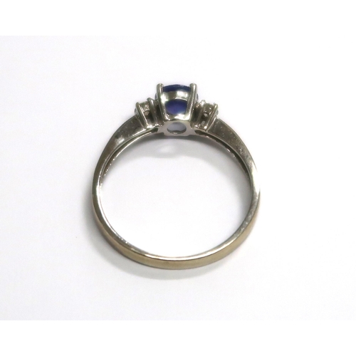 154 - A 14ct white gold Tanzanite ring - approx 0.65ct with receipt for $525 Dollars