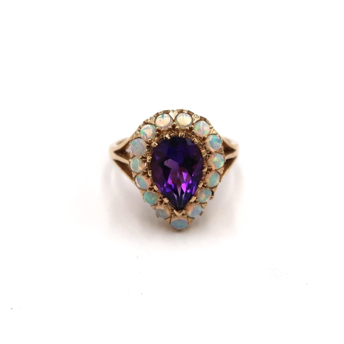 168 - A 9ct yellow gold amethyst and opal pear shaped ring, amethyst and opals are a good colour and well ... 