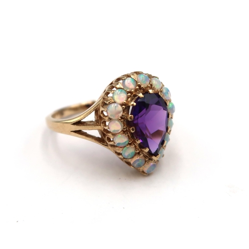 168 - A 9ct yellow gold amethyst and opal pear shaped ring, amethyst and opals are a good colour and well ... 