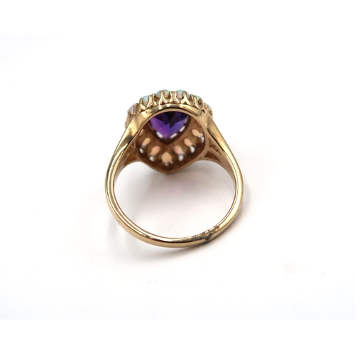 168 - A 9ct yellow gold amethyst and opal pear shaped ring, amethyst and opals are a good colour and well ... 