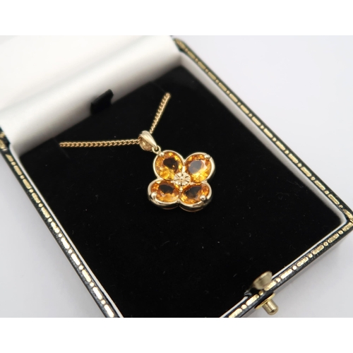 169 - A 9ct yellow gold citrine pendant, citrines are well cut and well matched, good colour, on a 9ct yel... 