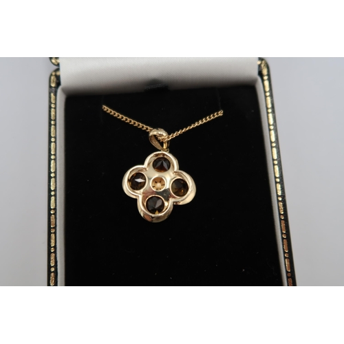 169 - A 9ct yellow gold citrine pendant, citrines are well cut and well matched, good colour, on a 9ct yel... 