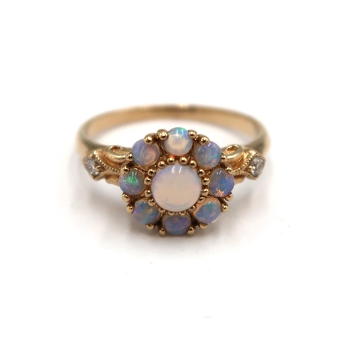 171 - A 9ct yellow gold opal and diamond ring, opals are a good colour and well matched with diamond shoul... 