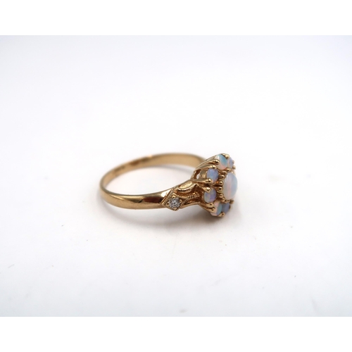 171 - A 9ct yellow gold opal and diamond ring, opals are a good colour and well matched with diamond shoul... 