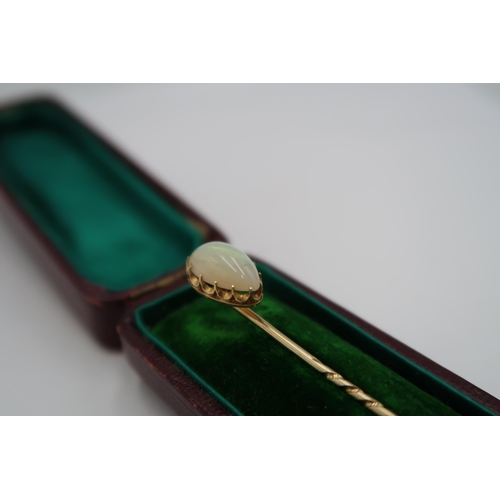 172 - A 9ct yellow gold (tested) pear shape opal stick pin, head size approx 13mm x 9mm, boxed