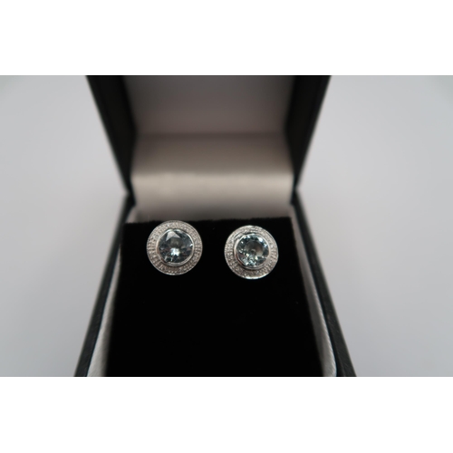 173 - An 18ct white gold aquamarine and diamond earrings, aquamarines are a good colour and well matched, ... 