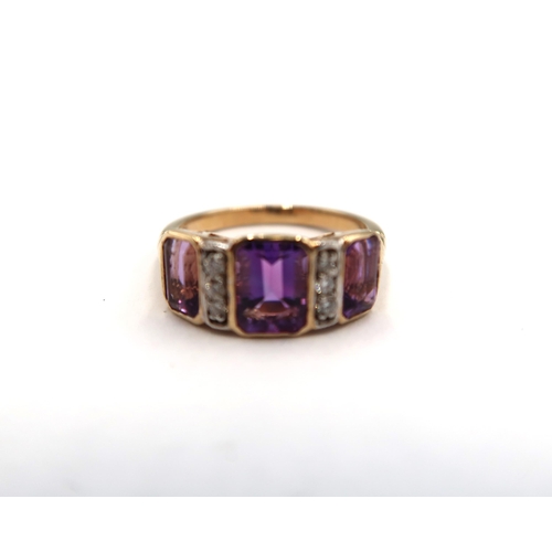 174 - A 9ct yellow gold Art Deco style three stone amethyst and diamond ring, amethysts and diamonds well ... 