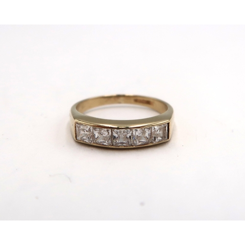 175 - A 9ct yellow gold five stone princess cut white zircon ring, head size approx 16mm x 4mm, size I/J