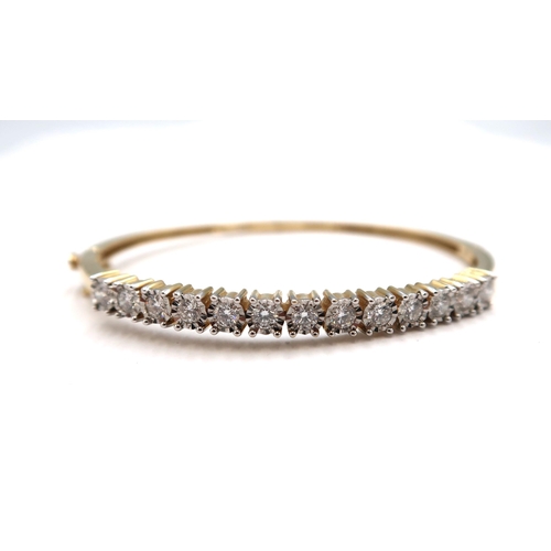 176 - A 14ct yellow gold hinged bangle set with approx 1.3ct of diamonds, diamonds are a good colour, colo... 