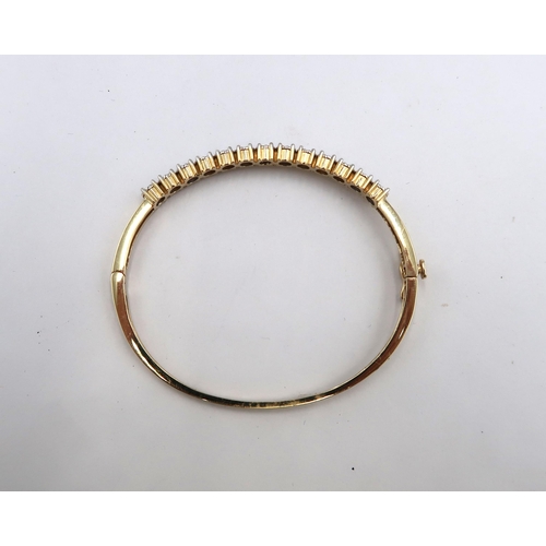 176 - A 14ct yellow gold hinged bangle set with approx 1.3ct of diamonds, diamonds are a good colour, colo... 