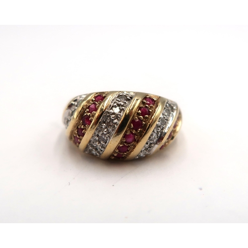 177 - A 9ct yellow gold ruby and diamond bombe ring, diamond and rubies are bright and lively, head size 2... 