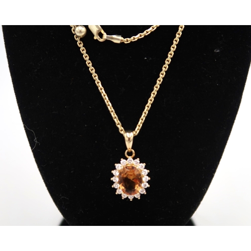 178 - A .925 silver gilt citrine and white zircon pendant with an adjustable chain, chain approx 48cms lon... 