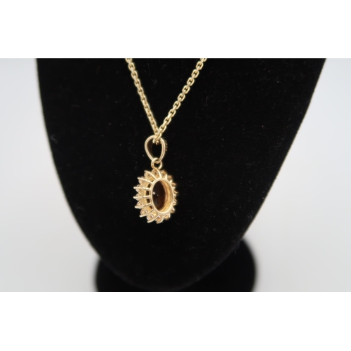 178 - A .925 silver gilt citrine and white zircon pendant with an adjustable chain, chain approx 48cms lon... 