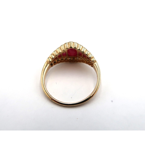 179 - A 9ct yellow gold Art Deco style ruby and diamond lozenge shape ring, rubies and diamonds are bright... 