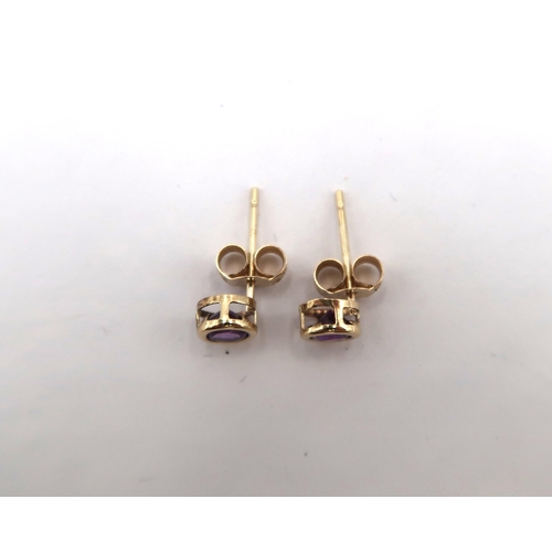 180 - A 9ct yellow gold amethyst stud earrings with 9ct backs, head size approx 5mm diameter