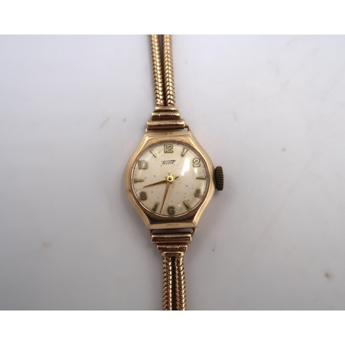 191 - A lady's 9ct gold cased Tissot cocktail watch with 9ct gold double snake link strap, total weight in... 