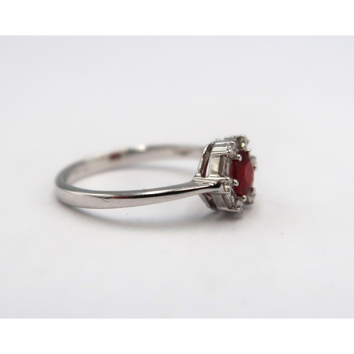 193 - An 18ct white gold quality ruby and diamond ring, pigeon blood ruby is a very good colour, diamonds ... 