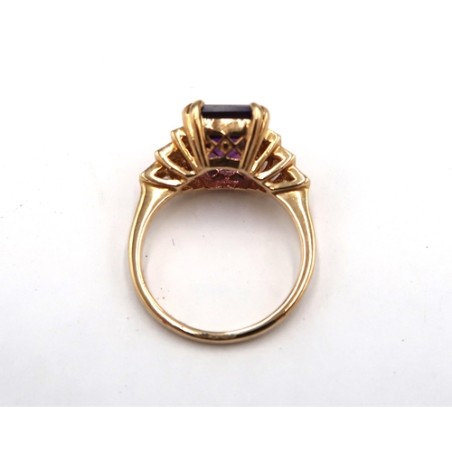 194 - A 9ct yellow gold Art Deco style amethyst and diamond stepped ring, amethyst is a good colour, diamo... 