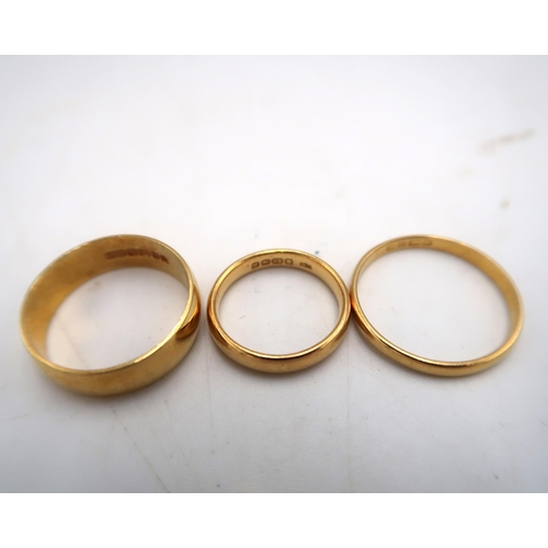 203 - Three hallmarked 22ct yellow gold wedding bands sizes Q/R, T & H - total eight approx 12.3 grams