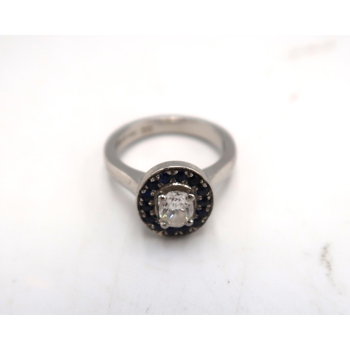 211 - A Harriet Kelsall diamond and sapphire engagement ring, the central diamond of approximately 0.64ct,... 