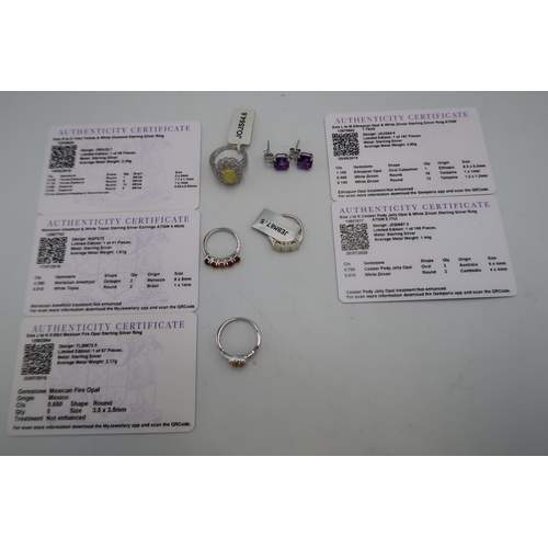 225 - An assortment of silver jewellery. To include jelly opal and zircon cluster ring, size M. An opal th... 