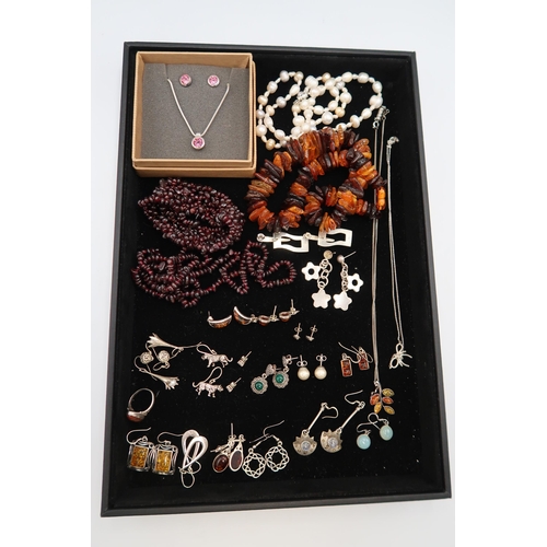 243 - A group of semi-precious jewellery including silver, amber, garnet and moonstone, and a set of silve... 