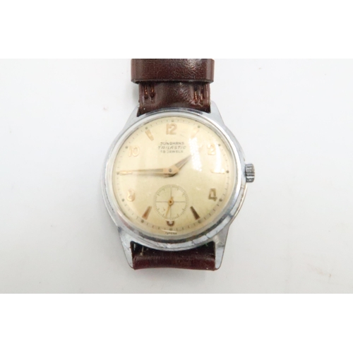 267 - A Junghams Trilastic wristwatch - in working order on a leather strap