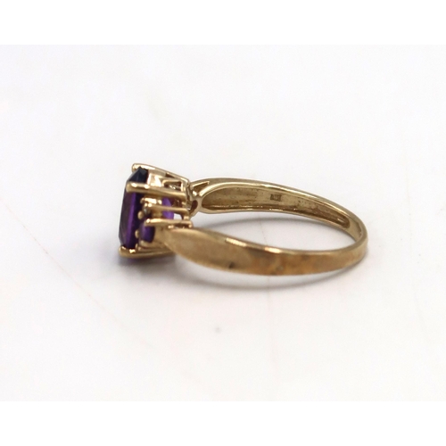 27 - A 9ct gold and amethyst dress ring, set with oval and round cut amethysts, size S, marked .375, appr... 