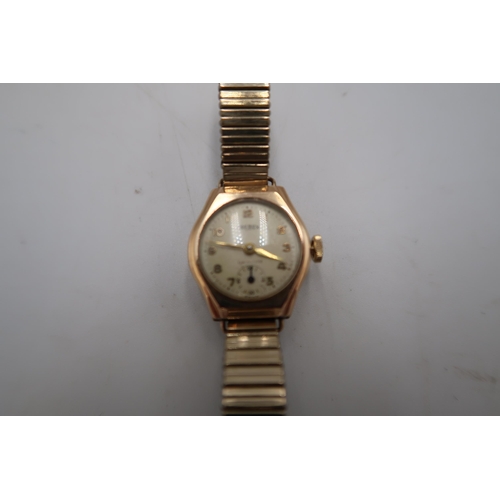 270 - A marked .375 yellow gold cased ladies wristwatch by Trebex - Arabic numerals on champagne coloured ... 