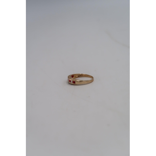 28 - A 14ct gold dress ring set with red and clear paste, size U, marked 585, approx weight 2.9g.