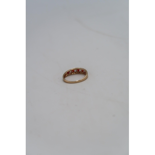 28 - A 14ct gold dress ring set with red and clear paste, size U, marked 585, approx weight 2.9g.