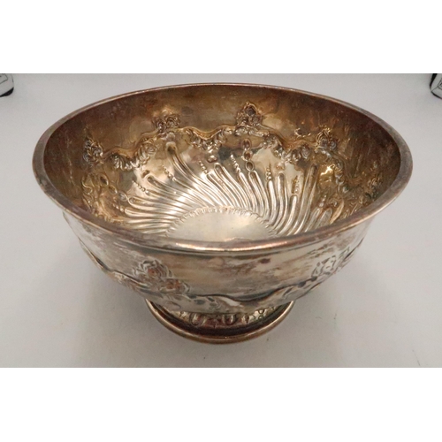 351 - A silver rose bowl, of circular pedestal form with chased and repousse garland above swirl and bubbl... 