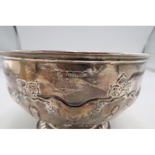 351 - A silver rose bowl, of circular pedestal form with chased and repousse garland above swirl and bubbl... 