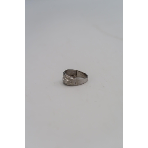 36 - A 9ct white gold dress ring with foliate engraving to the shoulder, size S, marked .375, 3.3g.