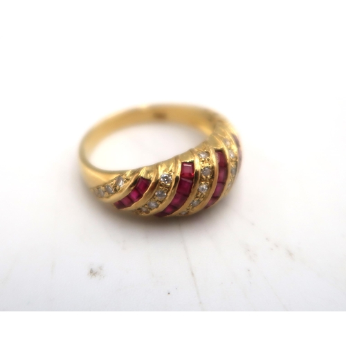 40 - An 18ct gold, ruby and diamond twist ring, size M, 4.41g.