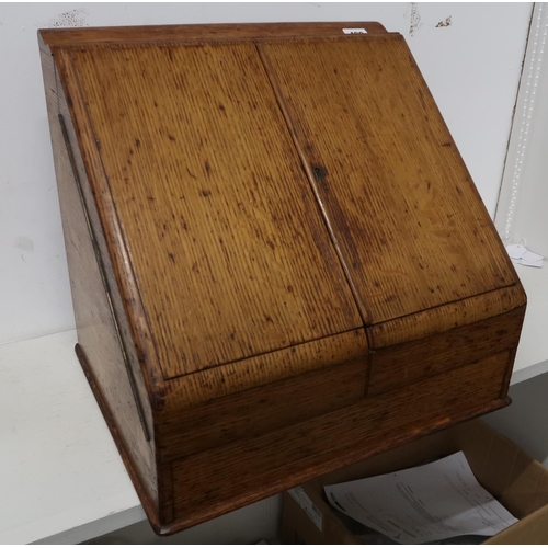 429 - An oak fitted correspondence box, the two doors opening to reveal a fitted compartment over drawer, ... 