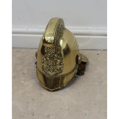 449 - A Brass Merryweather Fire mans Helmet Circa 1900.