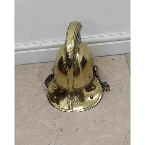 449 - A Brass Merryweather Fire mans Helmet Circa 1900.