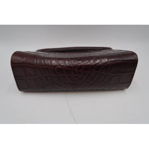 455 - A Mulberry leather handbag, or clutch bag, with crocodile texture to the matt brown leather, 17 by 2... 